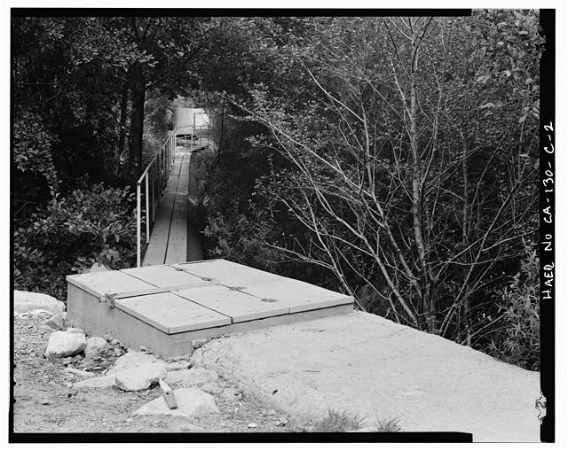 2. PLANK WALKWAY ATOP PIPE, ALSO SHOWING OVERFLOW CONTROL...