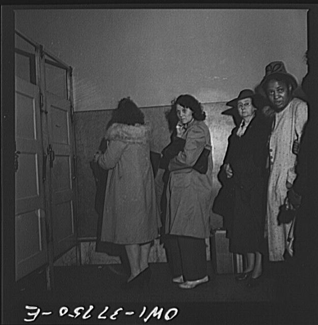 Indianapolis, Indiana. Bus passengers waiting in line to...