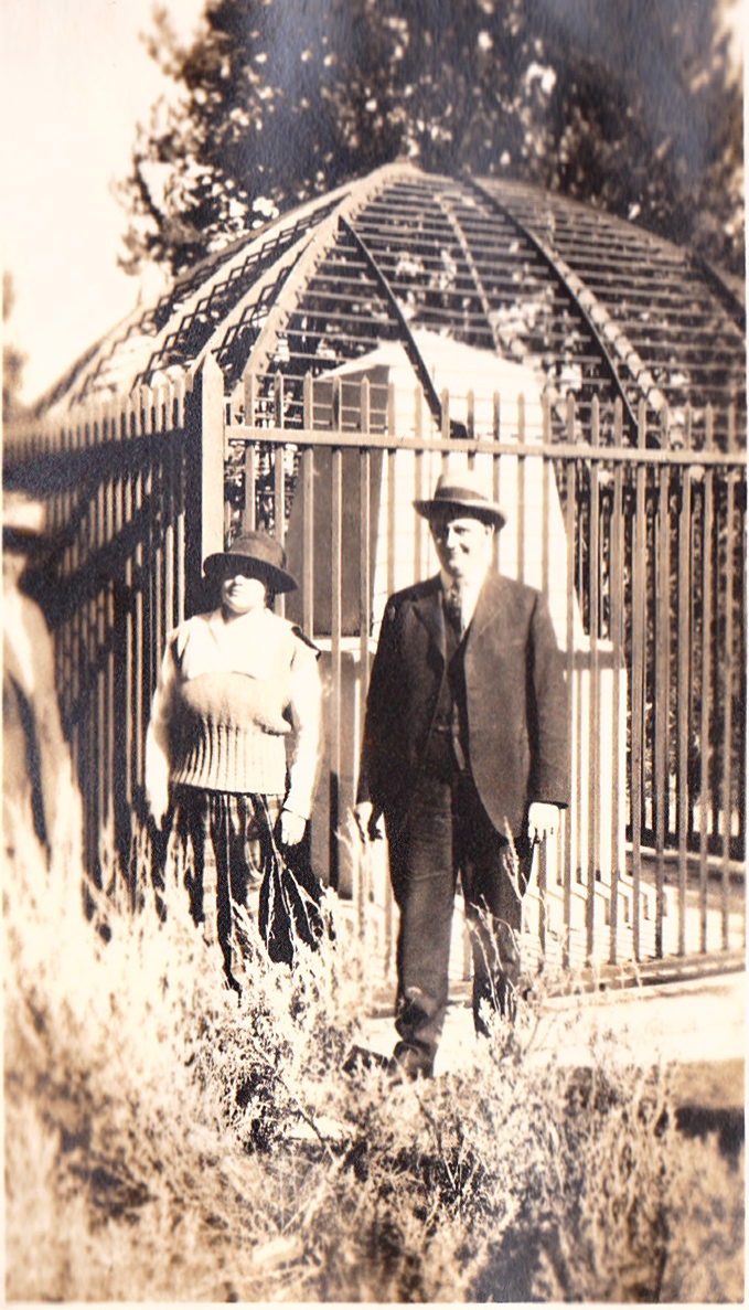 Couple in front of a cage