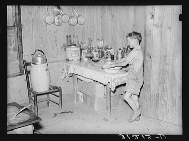 Southeast Missouri Farms. Son of sharecropper washing hands