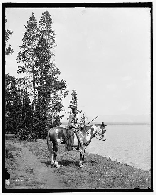 [Miss Waters on pinto pony (feather standing up)]