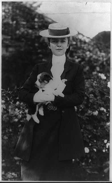 Alice Roosevelt in riding clothes, with dog