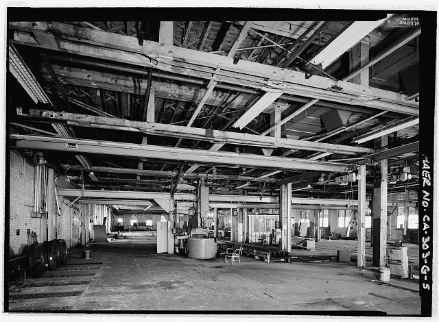 PLANING MILL, FIRST FLOOR INTERIOR, LOOKING WEST. A WHEEL...