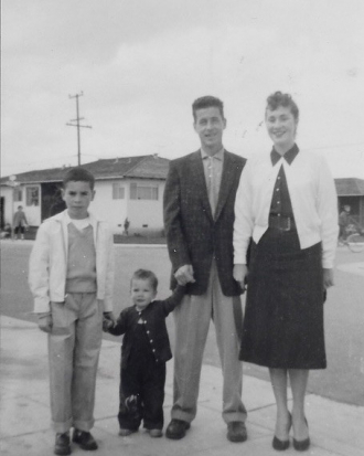 Family photo by our home in Fiesta Gardens