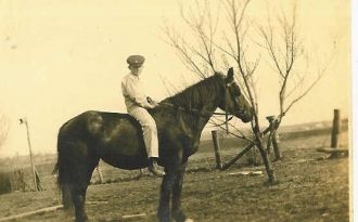 Young Roy E. Neal On His Horse