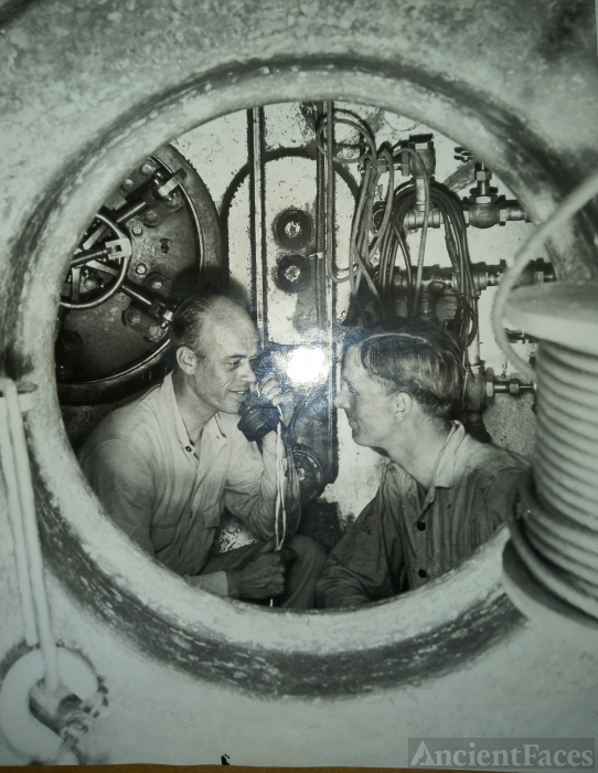 Testing telephone inside McCann submarine rescue chamber.