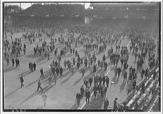 Crowds of people. Crowd on field leaving ball game