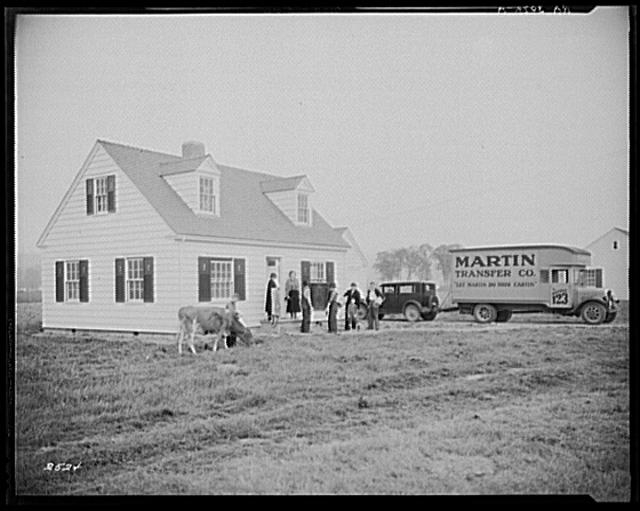 Family moving into their new home. Longview Homesteads,...
