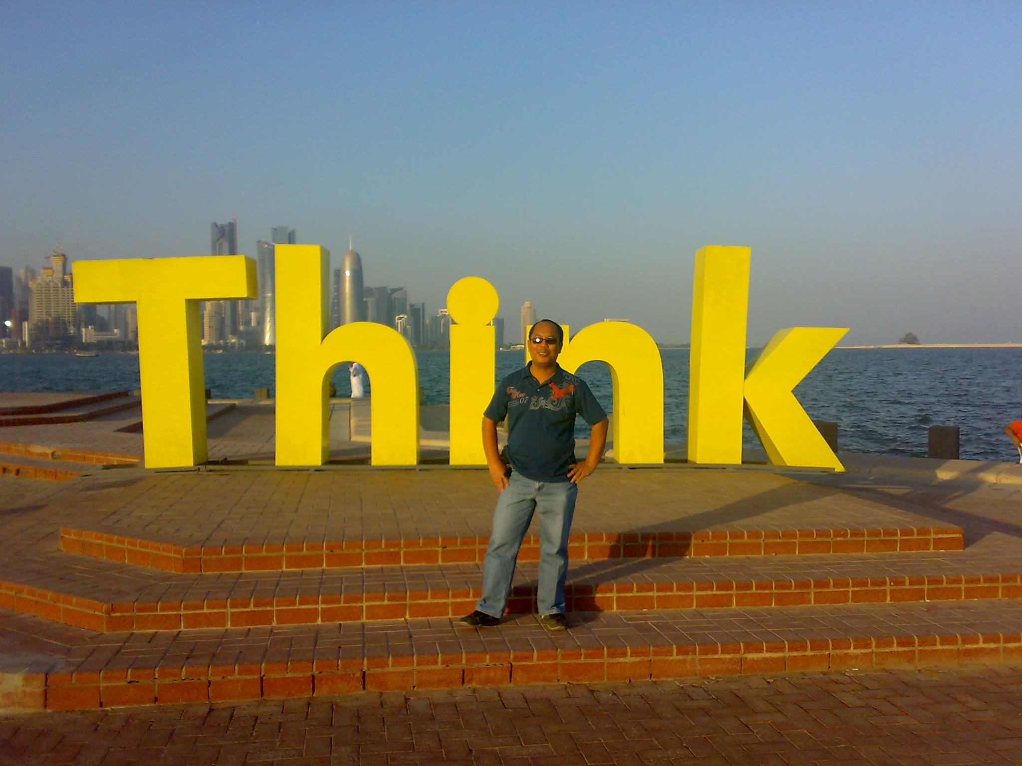 Baroro Man in front of Statue