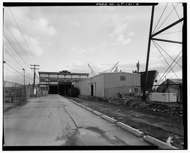 4. VIEW SOUTHEAST, END VIEW OF MAIN WAREHOUSE, LAND SIDE...