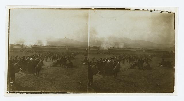 [Prisoners of war waiting for trains -- watching burning...