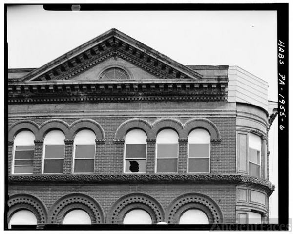 6. DETAIL OF FOURTH STORY WINDOWS AND ROOF PEDIMENT ON...