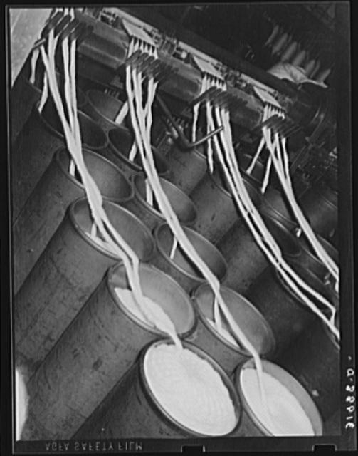 Bin of cotton rope being fed into thread-making machine....