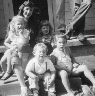 Norma Erickson with nieces and nephew