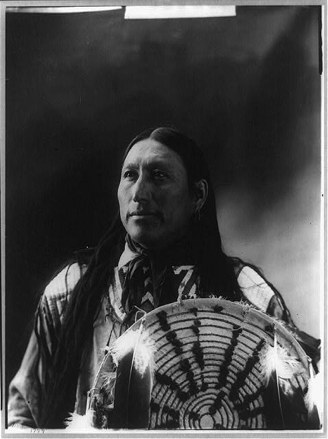[Big Man, half-length portrait, facing front holding...