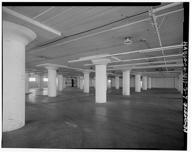 Interior of building, open storage area. Camera facing...