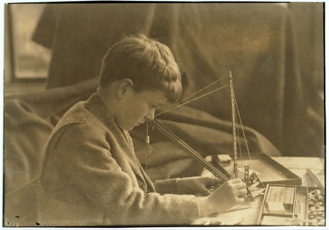 Miscellaneous. Boy with mechanical toy.