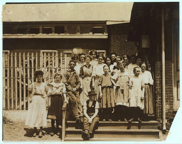 Groups of girl workers at the gate of the American...