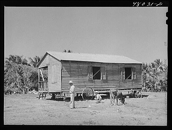 Arecibo, Puerto Rico. Moving a house to make room for a...