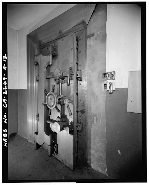 Bank vault-style door (closed) to hallway from within...