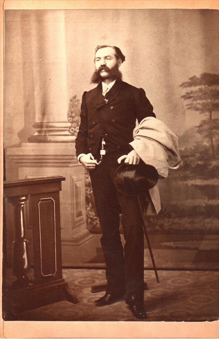 Man with mustache standing