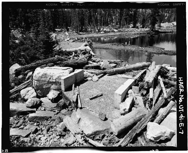 7. VIEW SHOWING DEBRIS-CHOKED CONCRETE SPILLWAY, LOOKING...