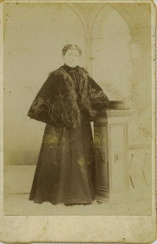 Woman with Fur trimmed cape