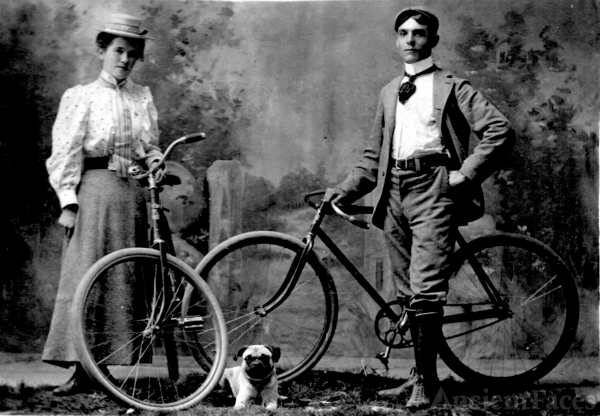 Young couple on bikes, 1900
