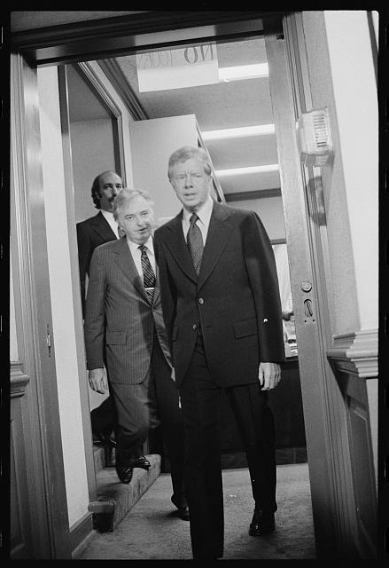 [President Jimmy Carter walks with members of the Three...
