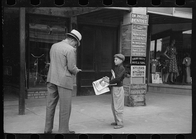 Newsboy on main street, Montrose, Colorado