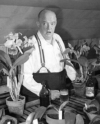 Sydney Greenstreet with orchids.