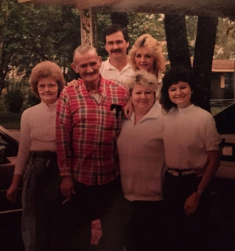 Lonnie Fugate and his children to his left bottom Bonita closes to him and joy, Marie behind Bonita, Allen behind Marie! Lonnie’s second wife to his right. There daughter Marie! 1st wife Linda Jean Fitzhugh !