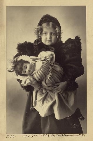 Unknown girl and doll