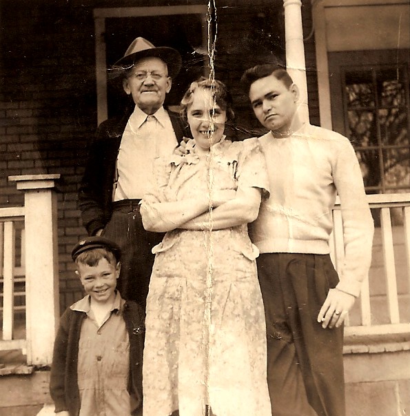 Loyd with wife Bertha, their son Bob Clark and boy unknown