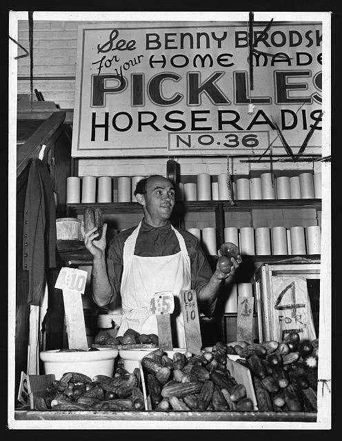 [Benny Brodsky, pushcart vendor, at his stand]