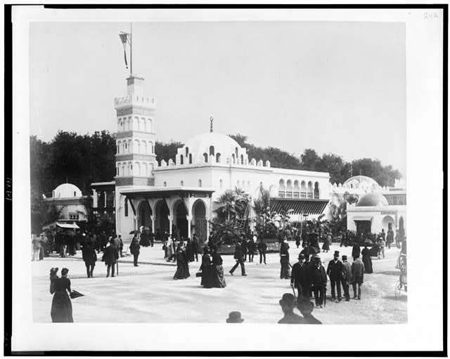 [Pavilion of Algeria, showing people on street in front...