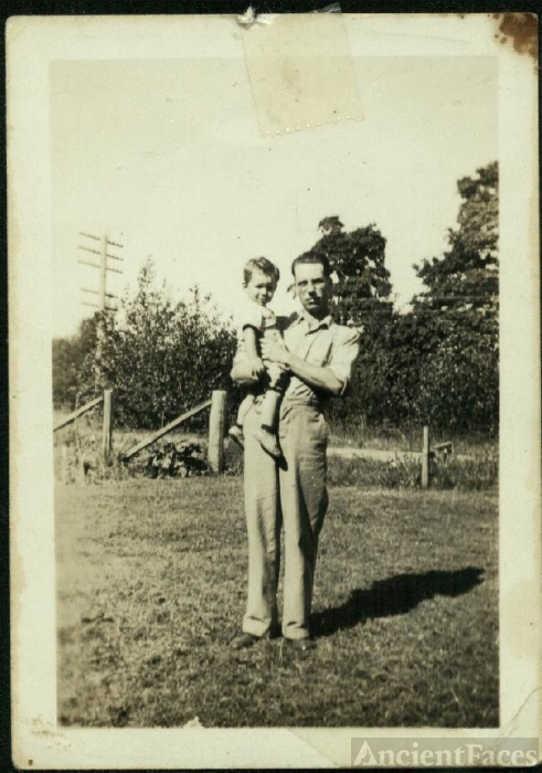 unknown young man & toddler