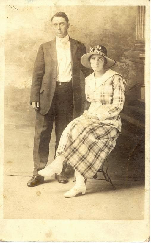 Man Standing & Woman Seated