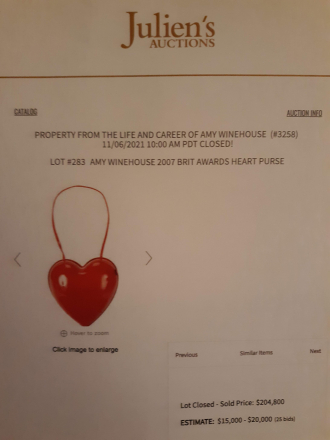 Amy Winehouse performing auction purse