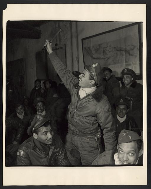 [Members of the 332nd Fighter Group in a briefing room,...