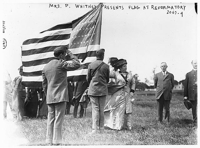 Mrs. P. Whitney presents flag at reformatory, [prison...