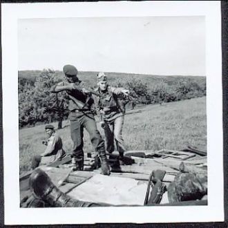 A photo of Sp/4 David "Woof" Whittle Aiming Rifle