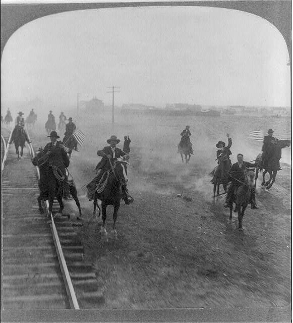 Cowboys following Teddy Roosevelt's Train