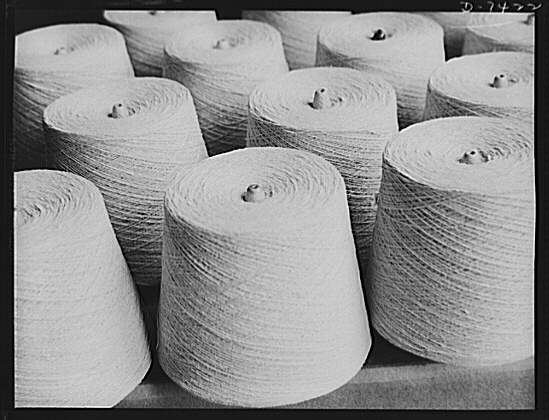 Discarded stockingss go to war. Spools of silk thread,...
