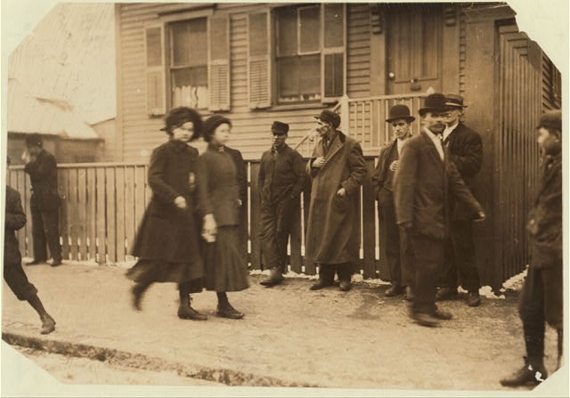 [Young girls running gauntlet of men making remarks...