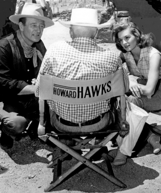 John Wayne and Angie Dickinson with Howard Hawks.