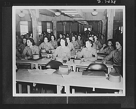 WAACS. Women's Army Auxiliary Corps in a classroom after...