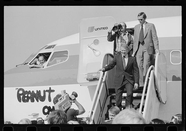 [Jimmy Carter disembarking from the airplane "Peanut One"...