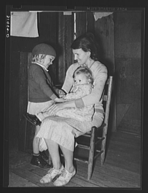 Mrs. Bagget and two children. Wife of sharecropper near...