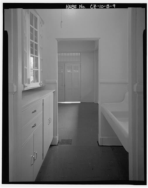 Interior view of pantry showing original cabinets and...